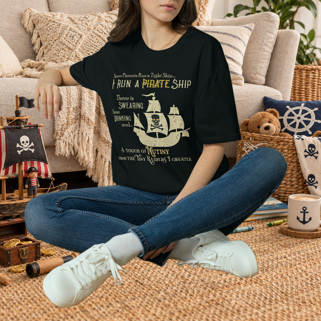 Black Pirate Ship parenting humor graphic T-shirt in a styled lifestyle scene