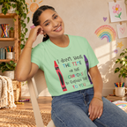 Model wearing the Mint Green Crayons graphic T-shirt in a lifestyle scene