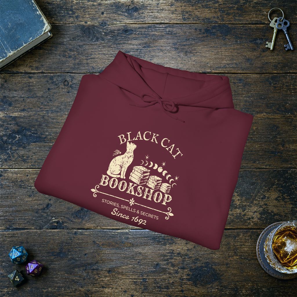 Black Cat Bookshop pullover hoodie in Maroon, folded mockup