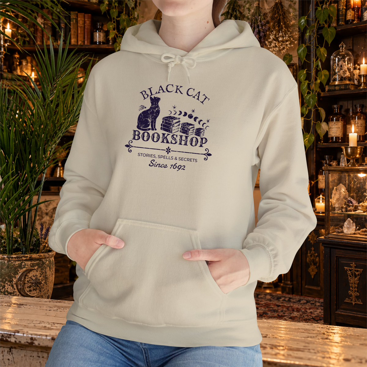 Black Cat Bookshop pullover hoodie in Sand, lifestyle mockup