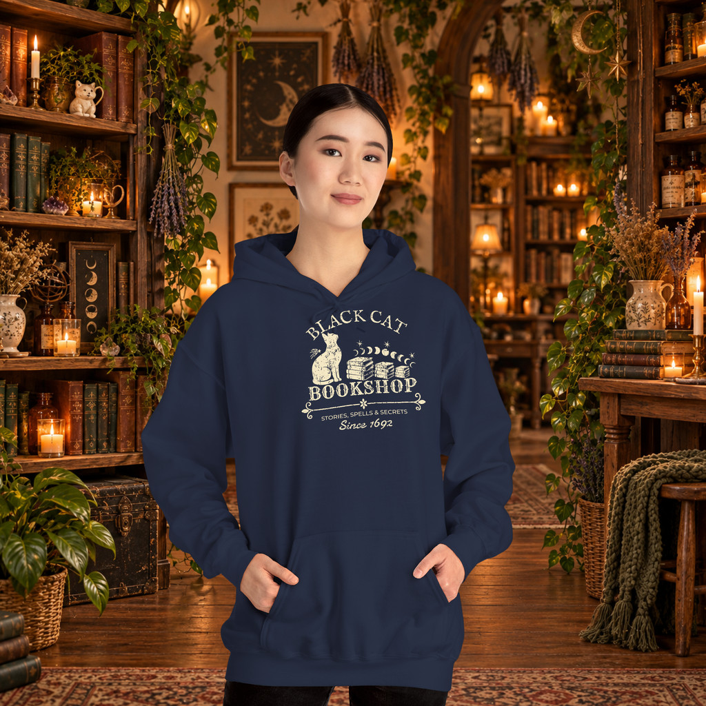 Black Cat Bookshop pullover hoodie in Navy, worn by a standing woman