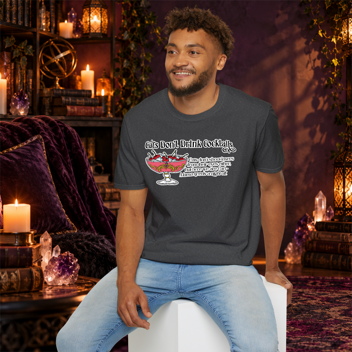 Cats Don’t Drink Cocktails graphic tee on seated man