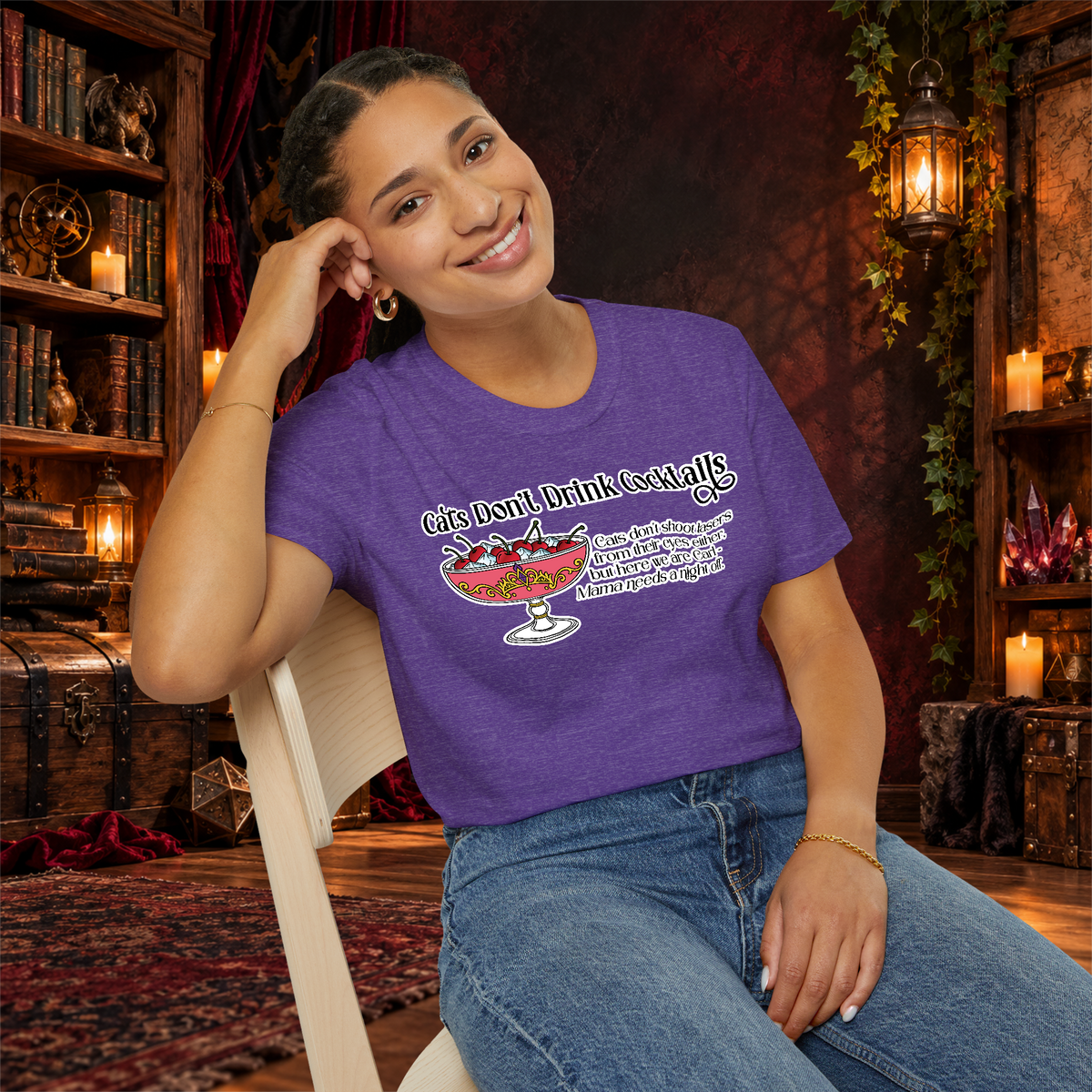 Cats Don’t Drink Cocktails graphic tee on seated woman