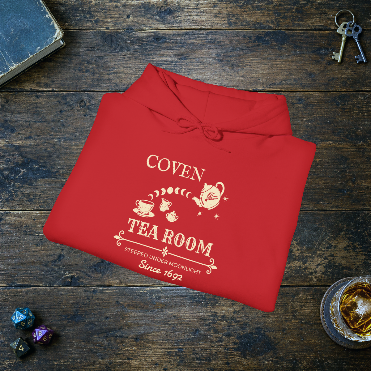 Coven Tea Room pullover hoodie in Red, folded mockup