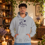 Coven Tea Room pullover hoodie in Sport Grey, worn by a standing man