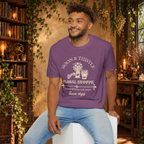 Moon and Thistle graphic tee on seated man