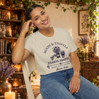 Moon and Thistle graphic tee on seated woman