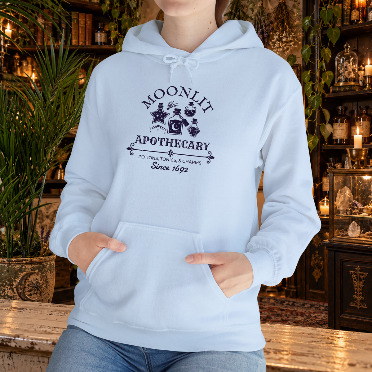 Moonlit Apothecary hoodie in light blue, lifestyle mockup
