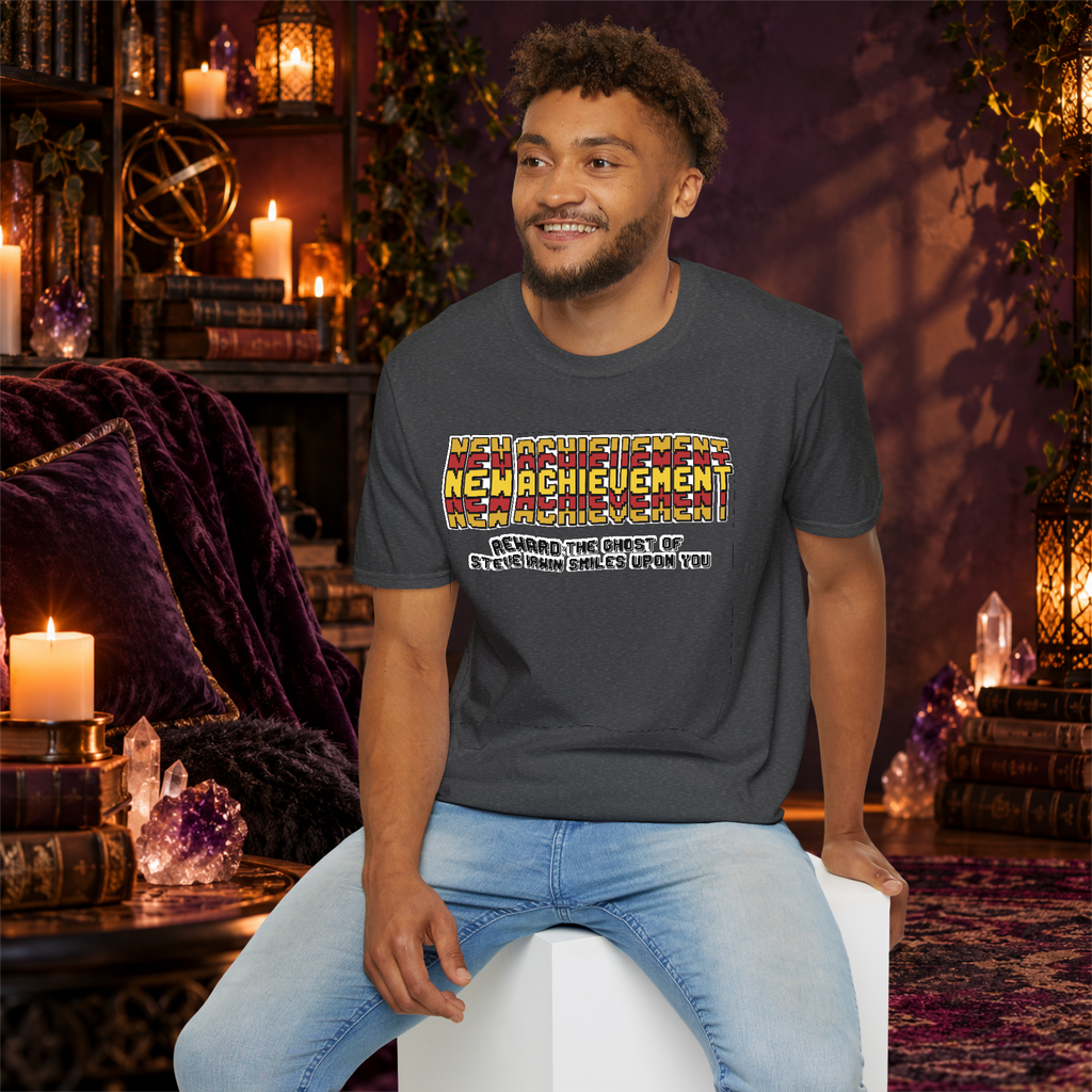 New Achievement graphic T-shirt modeled by a seated man