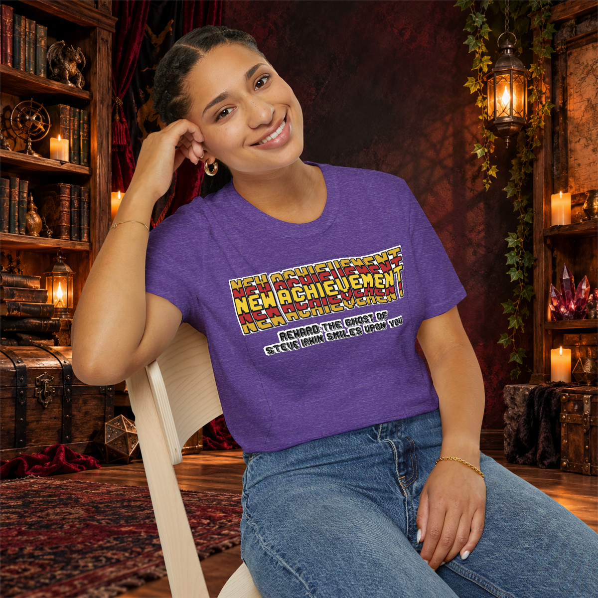 New Achievement graphic T-shirt modeled by a seated woman