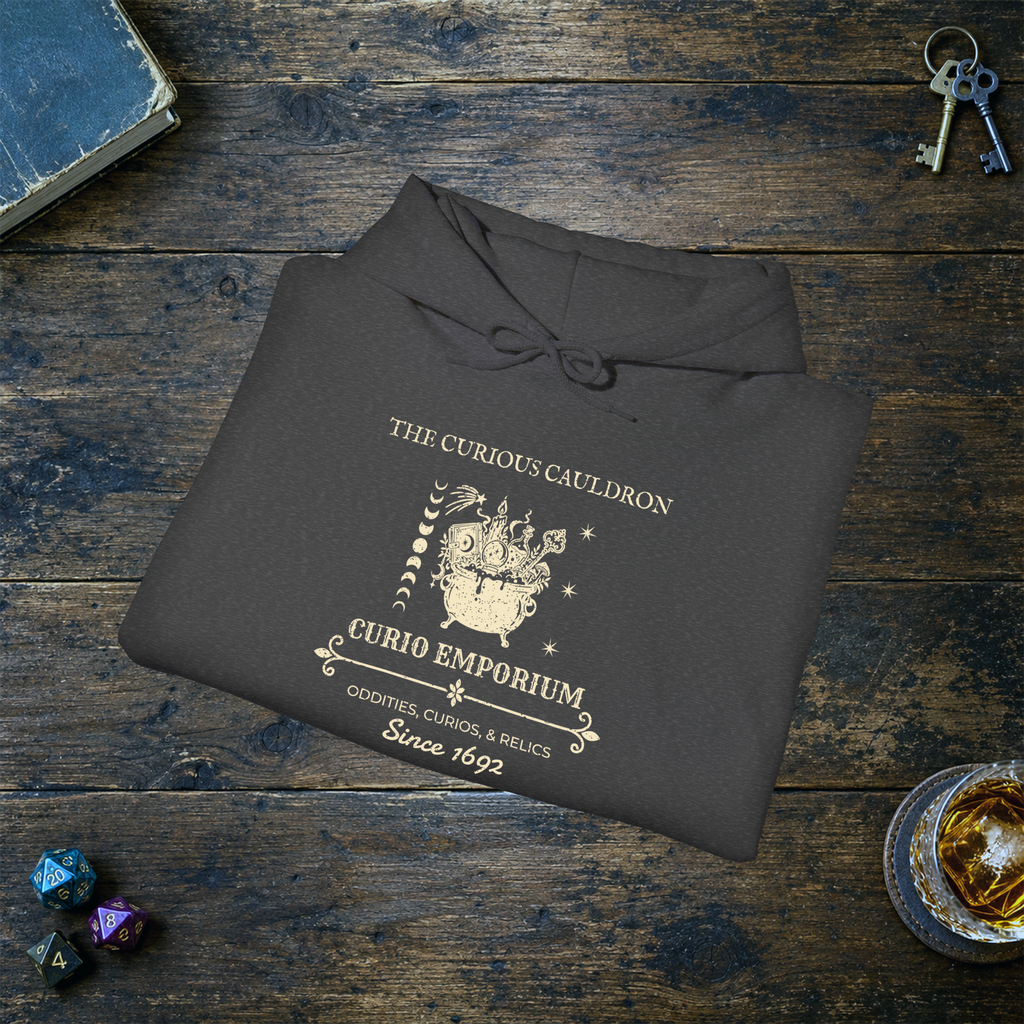 The Curious Cauldron hoodie in Dark Heather, folded mockup