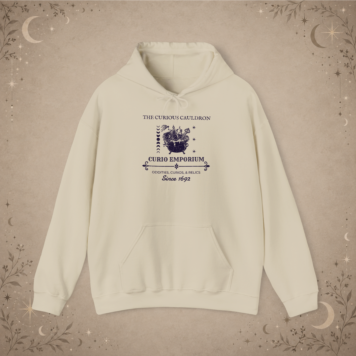 The Curious Cauldron hoodie in Sand, front view