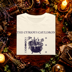 The Curious Cauldron folded graphic tee mockup