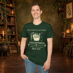 The Curious Cauldron graphic tee on standing man