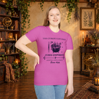 The Curious Cauldron graphic tee on standing woman