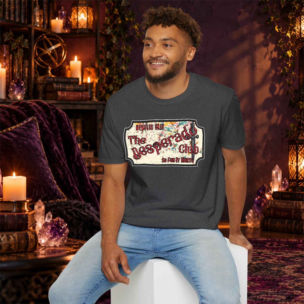 The Desperado Club graphic T-shirt modeled by a seated man