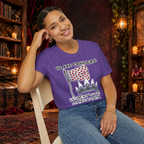 We Are Crawlers graphic T-shirt modeled by a seated woman