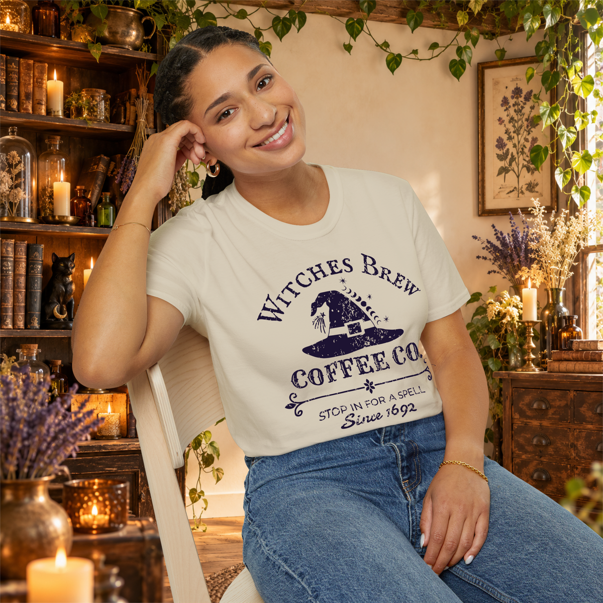 Witches Brew Coffee Co. graphic tee on seated woman
