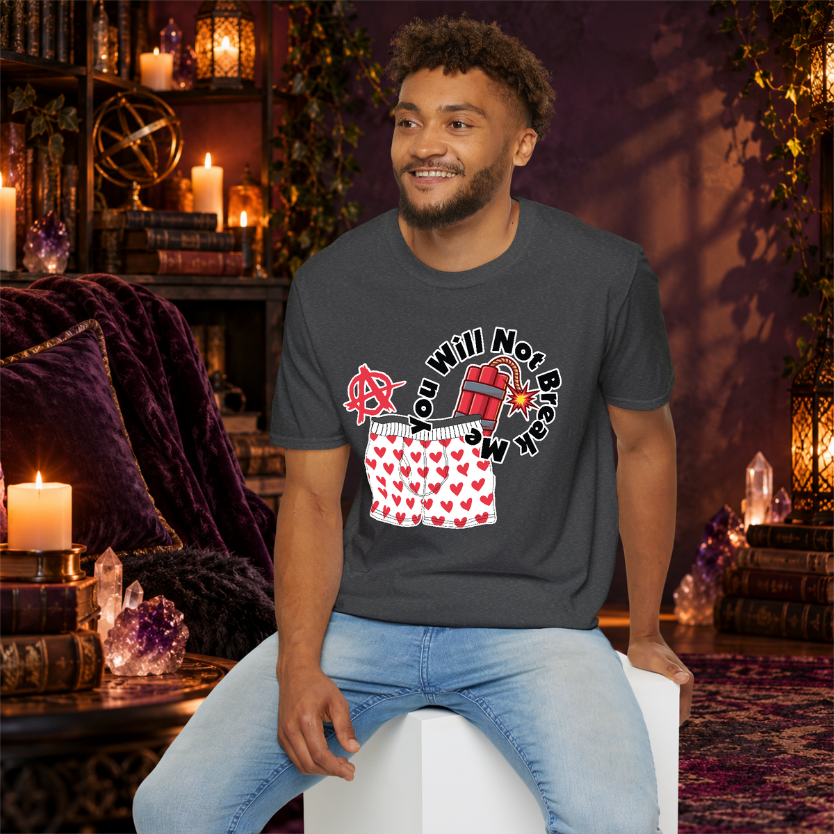 You Will Not Break Me graphic T-shirt modeled by a seated man